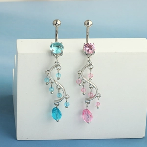 Detail of S-shaped curved belly rings with blue and pink cubic zirconia and bead charms