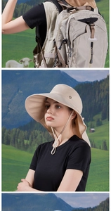 Close-up of a khaki sun hat with wide brim and adjustable drawstring in outdoor setting