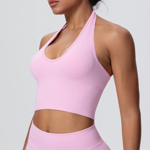 Close-up detail of pink halter neck sports bra in seamless ribbed knit fabric