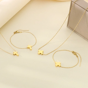 Golden stainless steel cross jewelry set with two necklaces and two bracelets