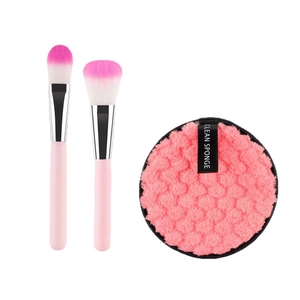 Pink makeup brush set with gradient bristles and plush facial clean sponge pad