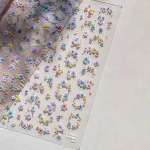 Close-up of TO-5100 5D embossed floral nail stickers with colorful pressed flower detail