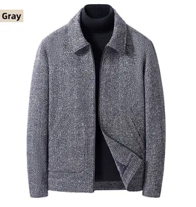Detailed macro view of men's grey herringbone wool jacket fabric with notch lapel