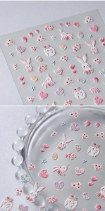 Detail of 5D embossed bunny nail stickers with hearts and floral patterns for Easter art
