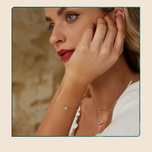 Close-up of elegant s925 sterling silver star bracelet on wrist with round gemstones