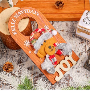 Detail view of wooden Christmas door hanger with plush bear and Feliz Navidad greeting