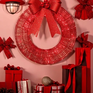 Red Christmas wreath with LED lights and large glitter bow on a festive wall display