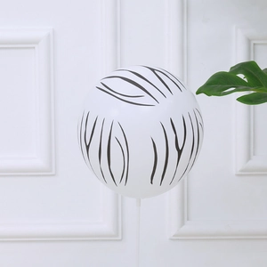 12-inch white latex balloon with black zebra stripes and stick for jungle themed parties