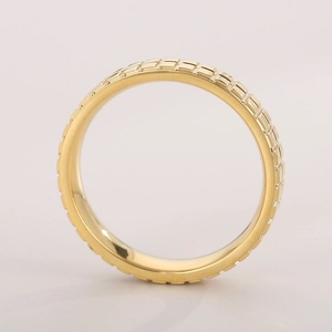 Detailed close-up of 18k gold plated stainless steel ring with checkered cube pattern