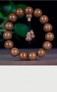 Macro detail of natural Wutai Mountain wooden beads with double gourd pendant and oil grain