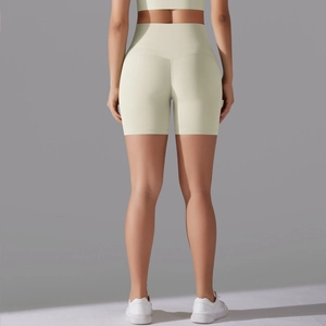 Rear view of high-waisted seamless yoga shorts in cream with butt-lifting contour lines