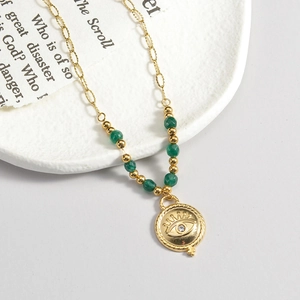 French vintage titanium steel necklace with 14K gold evil eye pendant and emerald green beads