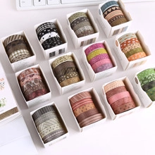 Detailed grid view of 20 rolls of decorative washi tape set in 12 gift boxes for DIY crafting