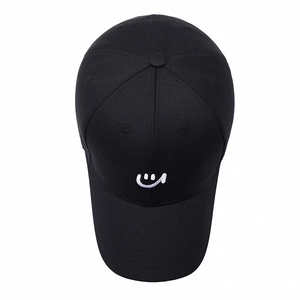 Classic black cotton baseball cap with white embroidered smiley face on the front