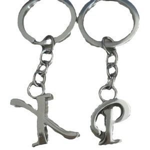 Polished silver alloy alphabet keychains featuring letters K and P on white background