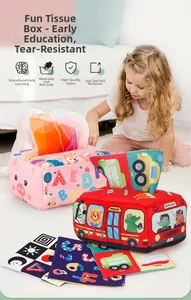 Toddler using washable soft cloth tissue box toy for early sensory learning and education