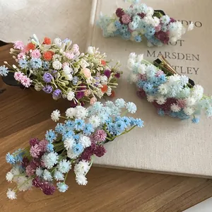 Elegant acrylic flower hair clips set in diverse colors on a rustic wooden background