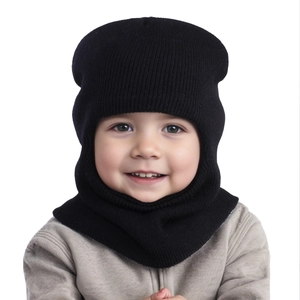 Detail of child wearing a black knitted hooded scarf with ear protection for winter warmth