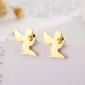 Macro shot of gold-plated stainless steel angel stud earrings on a white display card