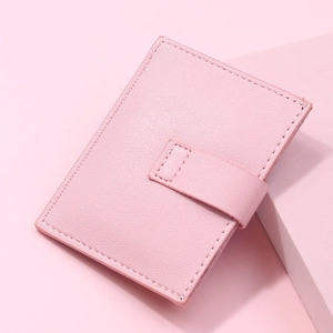 Slim pink lychee grain leather card holder with secure buckle closure for women