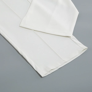 Close-up of clean white suit trousers hem showcasing premium fabric and stitching detail