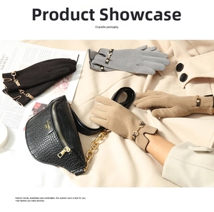 Detail view of stylish winter gloves with gold metal buckles on a wool coat background