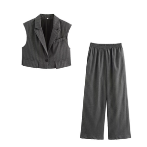 Detailed flat lay of grey pinstripe sleeveless waistcoat and wide leg trousers set