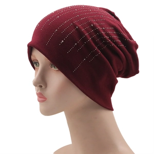 Women's burgundy knit beanie with sparkling silver rhinestones on a white background