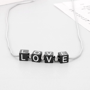 Modern silver snake chain necklace with black square LOVE letter beads and metal spacers