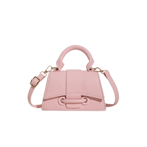 Pink pebbled leather mini crossbody bag with gold buckle and adjustable strap