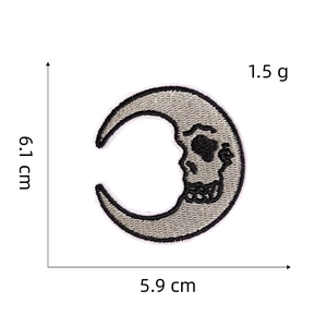 Close-up of a moon skull embroidered patch with detailed 6.1x5.9 cm size measurements