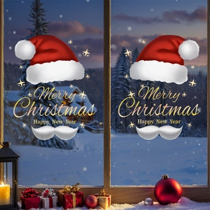 Christmas window decals with red Santa hat and Merry Christmas text on glass