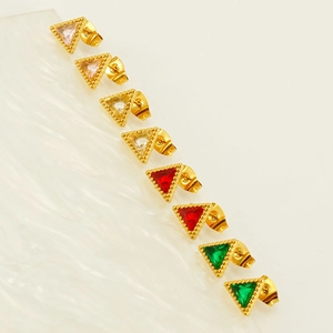 Triangle gold stud earrings with colorful zircon and milgrain detail in a flat lay view