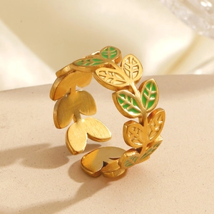 Golden titanium steel ring featuring green enamel leaves in a continuous leaf-wrap design