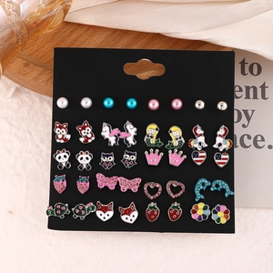 Macro detail of 20 pairs of kids' alloy stud earrings with colorful enamel animal shapes