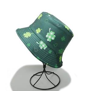 Detailed view of Saint Patrick's Day bucket hat with green clover shamrock prints
