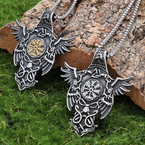 Viking compass necklaces with raven wings on natural wood bark and moss setting