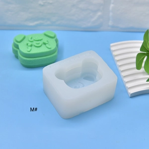 Detail view of cartoon bear silicone mold for DIY crafts with finished green model