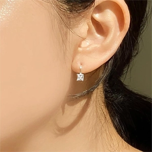 Minimalist 925 sterling silver hoop earrings with square zircon on model side view