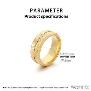 Detail view of 8mm golden stainless steel ring featuring feather engraving and zircon stone