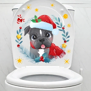 Detailed view of Christmas dog sticker with holly wreath on white ceramic toilet lid