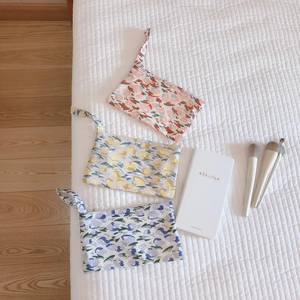 Three-piece floral cotton wristlet pouch set in red, yellow, and blue colors
