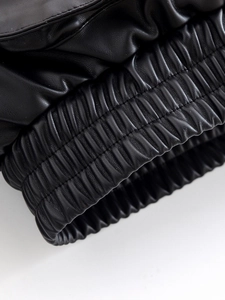 Detailed macro shot of premium black PU leather jacket cuff with precise stitching