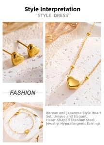 Macro detail of the polished 18K gold heart-shaped jewelry set made of titanium steel