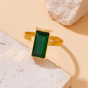 Adjustable gold stainless steel ring with rectangular emerald green gemstone centerpiece