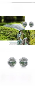 Macro detail of S925 silver stud earrings with 5mm natural green moss agate stone