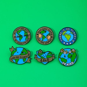 Set of 6 cartoon eco-friendly enamel pins with Earth Day slogans on green background