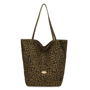 Detail of large leopard print tote bag with canvas texture and handmade metal label