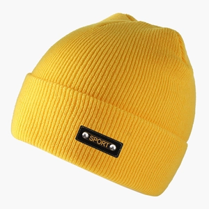 Detail of yellow ribbed knit beanie with black leather SPORT patch and metal rivets