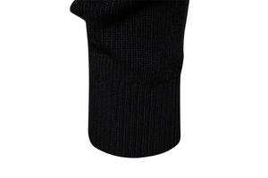 Detail of black men's sweater featuring fine ribbed knit texture on cuff and hemline